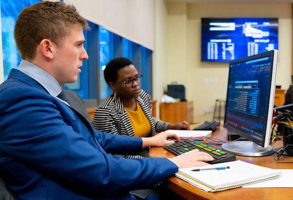 Image of a student working in a computer lab on campus.